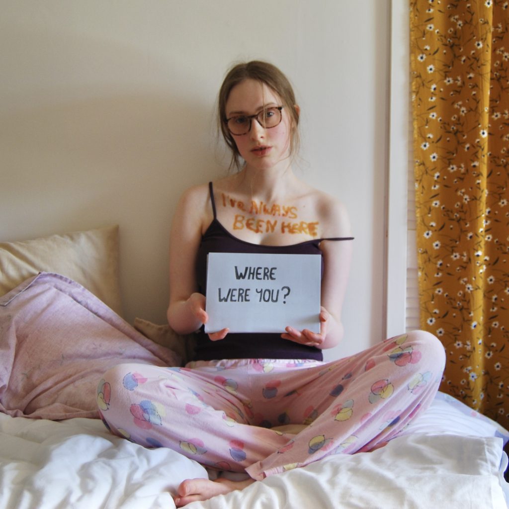 A final photograph to end the official sign series, Sakara is once again holding the "where were you" sign.