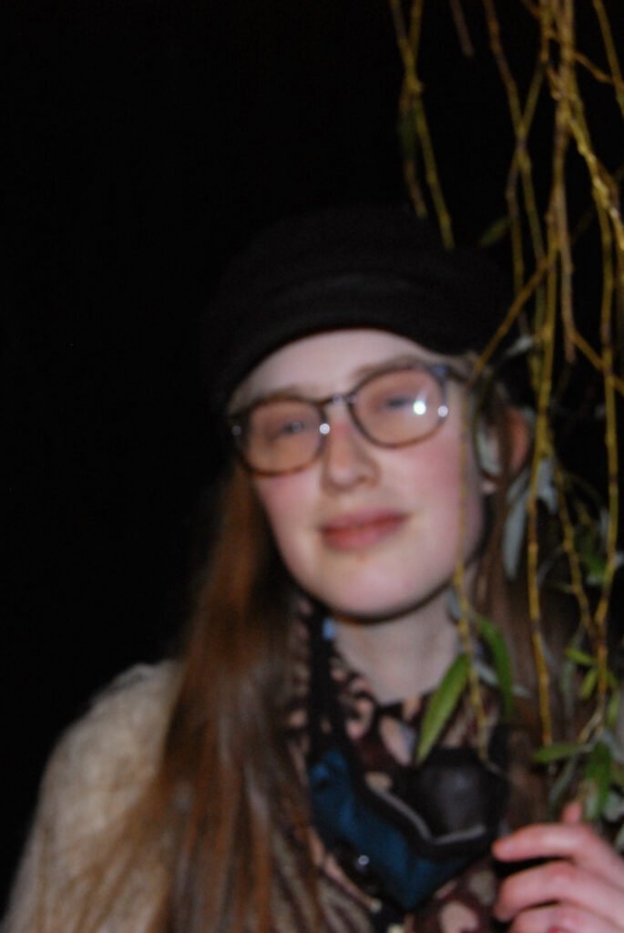 Blurry image of Sakara's face.