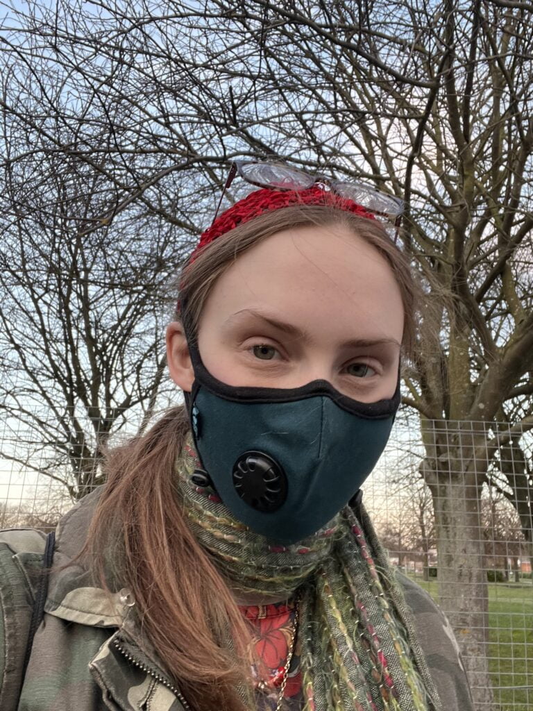 Selfie of Sakara wearing their mask.